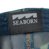 detail photo of tag. seaborn wave logo and seaborn text in white on black background.